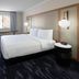 Fairfield by Marriott Inn & Suites Seattle Sea-Tac Airport guest room with king bed and desk in Seattle