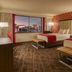 Horseshoe Las Vegas guest room with two beds and city view through large window