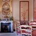 Prince Conti Hotel New Orleans dining room with white fireplace, ornate mirror, and red-accented decor