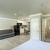 Alexis Park All Suite Resort Las Vegas suite with sofa, kitchenette, desk and bathroom doorway