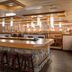 Ramada by Wyndham Thunder Bay Airlane Hotel bar with stone counter and stools in Thunder Bay