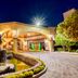 Holiday Inn Queretaro-Centro Historico By IHG exterior at night with arched entrance and fountain