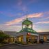 Best Western Plus Stoneridge Inn & Conference Centre in London exterior at sunset