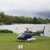 Carolyn Beach Inn in Thessalon with a helicopter on the lawn beside a lakeside view