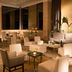 Marquis Reforma in Mexico City lobby lounge with seating, candles, and tall plants