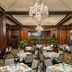 Omni Parker House Boston elegant wood-paneled dining room with chandeliers and set tables
