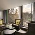 Grand Bohemian Lodge Greenville lounge with floor-to-ceiling windows and scenic river view