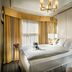 Staypineapple, An Elegant Hotel, Union Square room with king bed, window seating and chandelier in San Francisco