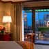 The Bostonian Boston guest room with Boston skyline view through a balcony window