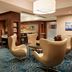 Marriott Downtown at CF Toronto Eaton Centre lounge in Toronto with seating area and patterned carpet