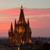 Casa de Sierra Nevada, A Belmond Hotel, San Miguel de Allende at sunset with illuminated church spires