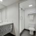 Thunderbird Boutique Hotel in Las Vegas bathroom with vanity, mirror, shower, and toilet