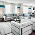 Four Points by Sheraton London living room suite with sectional sofa, armchairs, desk and kitchenette