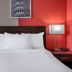 Ramada by Wyndham Thunder Bay Airlane Hotel bedroom with king bed and bedside lamps in Thunder Bay