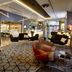 Pullman London St Pancras lobby lounge with modern seating and geometric patterned floor in London