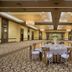 Four Points by Sheraton London ballroom with round banquet tables and patterned carpet