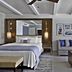 Fairmont El San Juan Hotel Carolina guest room with king bed, sofa, coffee table and ceiling fan