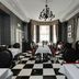 Park International Hotel London dining room with black-and-white checkered floor and chandelier