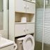Saint Lawrence Residences and Suites Toronto bathroom with storage cabinet and frosted glass shower enclosure