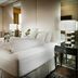 Staypineapple, An Elegant Hotel, Union Square, San Francisco guest room with king bed and sitting area