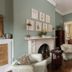 The College Club of Boston in Boston: elegant lounge with fireplace, armchairs, hardwood floors and artwork