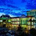 The Orleans Hotel & Casino in Las Vegas exterior at dusk with lit facade and parking lot