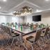 Crowne Plaza Toronto Airport By IHG meeting room with large conference table and wall-mounted TV