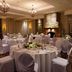 Best Western Plus Stoneridge Inn & Conference Centre ballroom in London with round banquet tables and stone fireplace