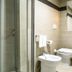 Hotel Pineta Palace Rome modern bathroom with glass shower, bidet, toilet, and sink