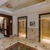 Club Quarters Hotel Faneuil Hall, Boston lobby with two elevators and marble tile floor