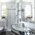 Dom Hotel Augsburg bathroom with walk-in shower, toilet, sink and bright window