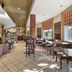 Best Western Plus Stoneridge Inn & Conference Centre in London, bright dining area with tables and bar
