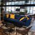 Original Sokos Hotel Lappee in Lappeenranta lounge with blue sofa, patterned chairs and dining tables
