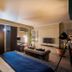 62 Castle Street Liverpool room with king bed, sofa seating, desk and wall-mounted TV