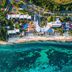 Aerial view of Melia Cozumel, Cozumel beachfront resort with pools and turquoise water