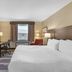 Best Western Plus Stoneridge Inn & Conference Centre guest room in London with king bed, desk and window view