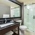 Comfort Inn Kingston - Highway 401 bathroom with glass shower and vanity in Kingston