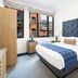 Hotel Indigo Boston Garden Boston guest room with king bed and city views