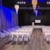 Thunderbird Boutique Hotel in Las Vegas event space with banquet tables, white chairs, and stage lighting