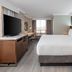 Crowne Plaza Toronto Airport guest room with king bed, desk, TV and city-view window in Toronto