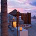 Grand Oasis Tulum in Akumal: beachfront sunset yoga with overwater palapas and lantern-lit sand