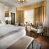 Staypineapple, An Elegant Hotel, Union Square room with king bed, chair and window seating in San Francisco