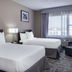 Ramada by Wyndham Thunder Bay Airlane Hotel room in Thunder Bay with two beds and window seating