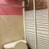 Saint Lawrence Residences and Suites in Toronto bathroom with glass shower enclosure and toilet