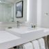 Radisson Hotel Seattle Airport SeaTac bathroom vanity with sink, mirror and shower