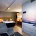 Original Sokos Hotel Lappee room in Lappeenranta with bed, desk and lake mural