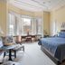 The College Club of Boston in Boston bedroom with bay windows, desk, and blue bedspread