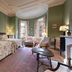 The College Club of Boston guest room in Boston with twin beds, bay window seating, and fireplace