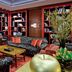 The Bostonian Boston library lounge in Boston with red bookshelves, patterned sofas and a coffee table