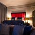 62 Castle Street Liverpool hotel room with king bed, blue sofa, patterned wall and tripod floor lamp